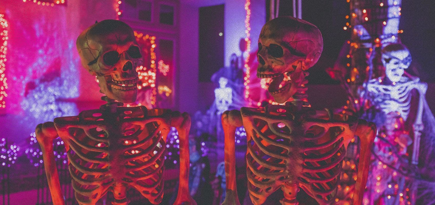 two skeletons in neon lights